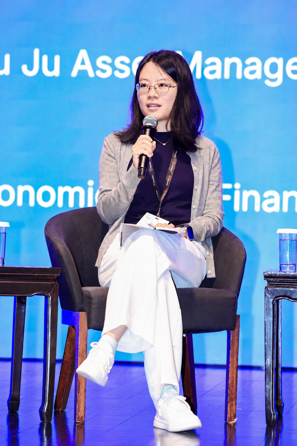 Yan Xiong speaking at a conference